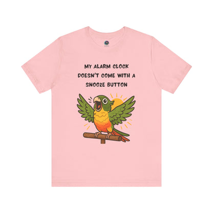Parrot Alarm Clock T-Shirt – Funny Parrot Wake-Up Call Tee in Pink, featuring the bright and noisy parrot illustration along with the humorous wake-up call phrase printed cleanly on the fabric.