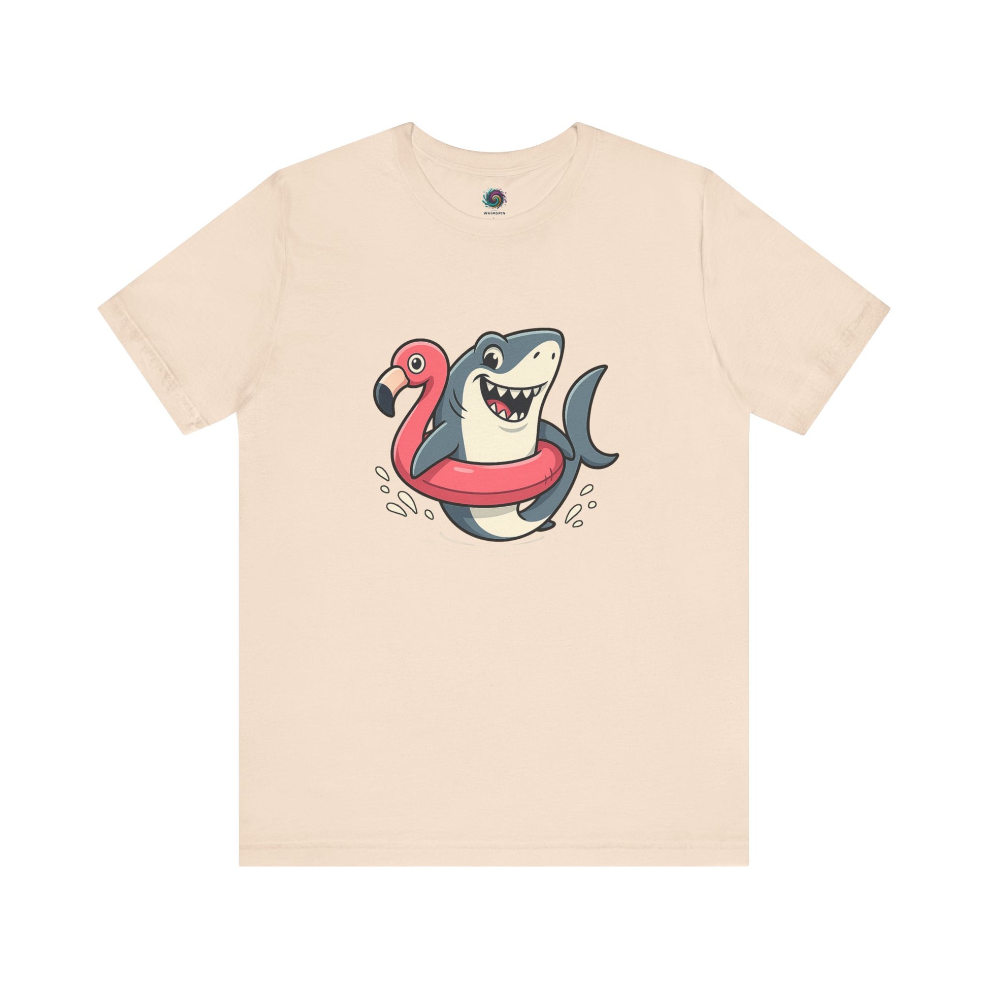 Shark Flamingo Floatie T-Shirt – Funny Beach & Pool Day Tee in soft cream with lighthearted cartoon of shark in floatie