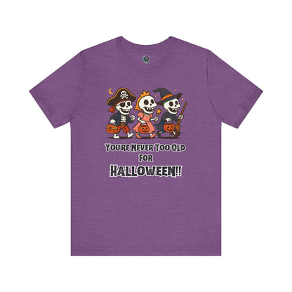 Never Too Old for Halloween T-Shirt – Funny Adult Halloween Shirt in heather team purple, presented flat with its festive adult-themed skeleton design.