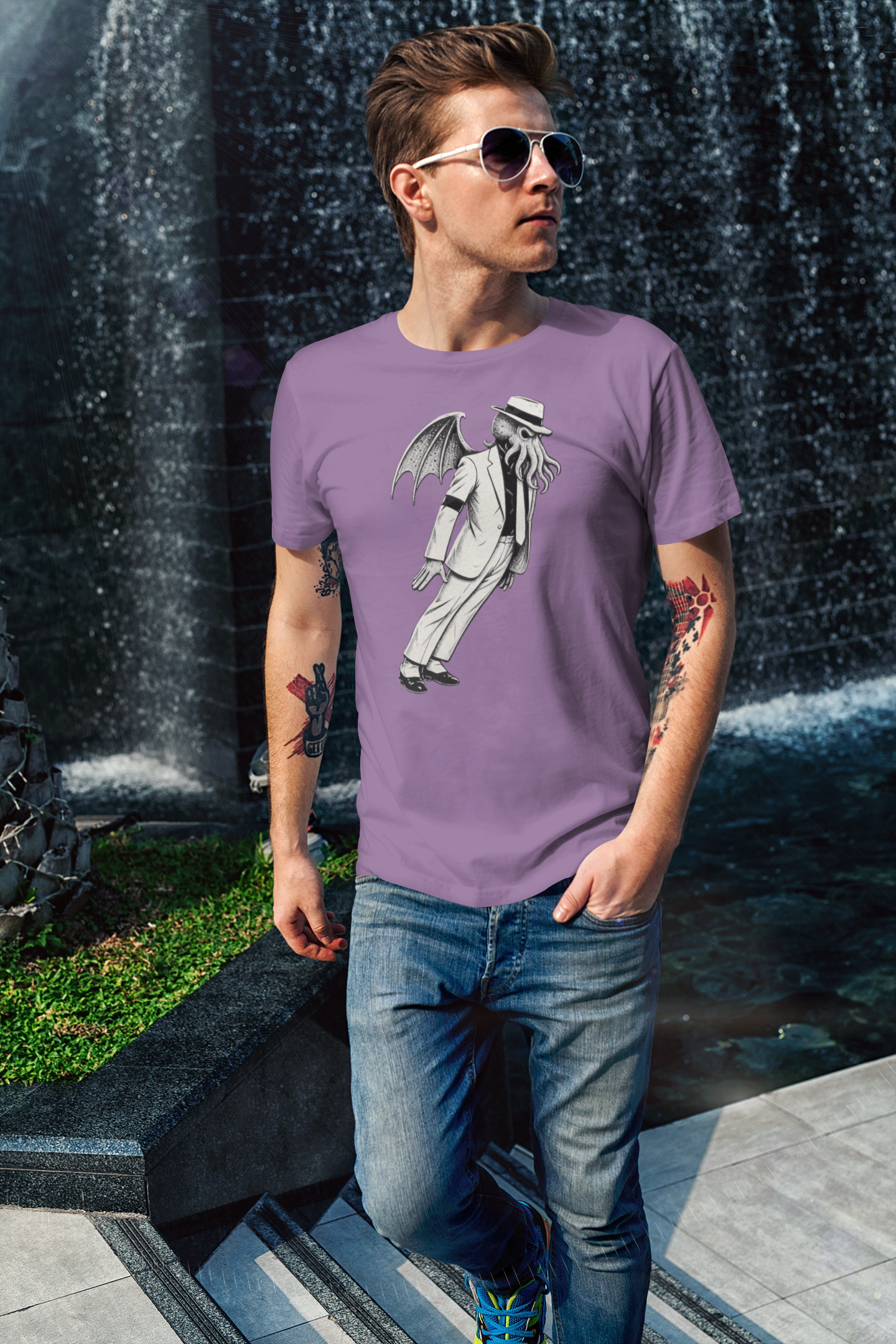 Smooth Cthulhu Unisex T-Shirt – Lovecraft Meets Smooth Criminal Style in light purple, modeled with sunglasses near waterfall, fun Cthulhu King of Pop parody tee.