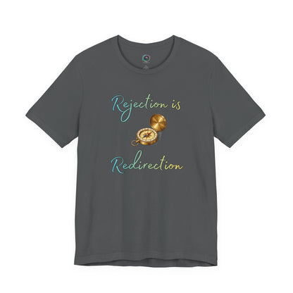 Rejection Is Redirection T-Shirt – Motivational Compass Quote Tee in asphalt gray featuring the rejection is redirection phrase with a detailed compass graphic