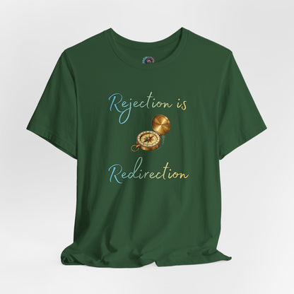 Rejection Is Redirection T-Shirt – Motivational Compass Quote Tee in evergreen green featuring the rejection is redirection quote and compass artwork