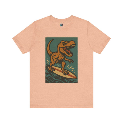 Surfing T-Rex T-Shirt – Funny Dinosaur surfing Graphic Tee for Summer Vibes in heather peach, featuring a vintage-style surfing dinosaur — a go-to for beach lovers and surf tees.