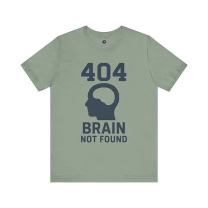 Sage "404 Brain Not Found T-Shirt" from WhimSpin. The tshirt graphic is a profile image of a human head with an empty hole where the brain should be and the text "404 Brain Not Found."