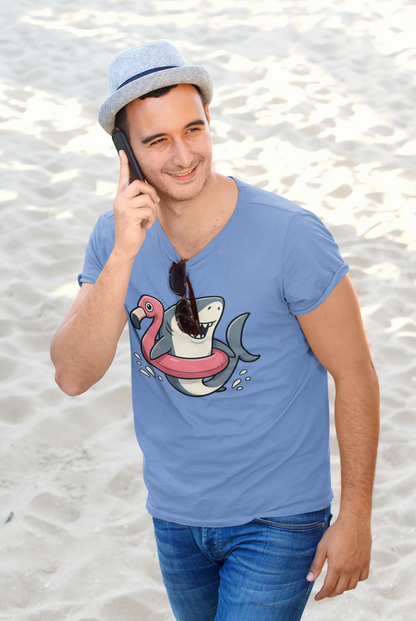 Man on a call at the beach wearing Shark Flamingo Floatie T-Shirt – Funny Beach & Pool Day Tee with sunglasses hanging