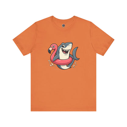 Shark Flamingo Floatie T-Shirt – Funny Beach & Pool Day Tee in burnt orange with smiling shark and flamingo float design
