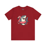 Shark Flamingo Floatie T-Shirt – Funny Beach & Pool Day Tee in canvas red featuring humorous beach shark artwork