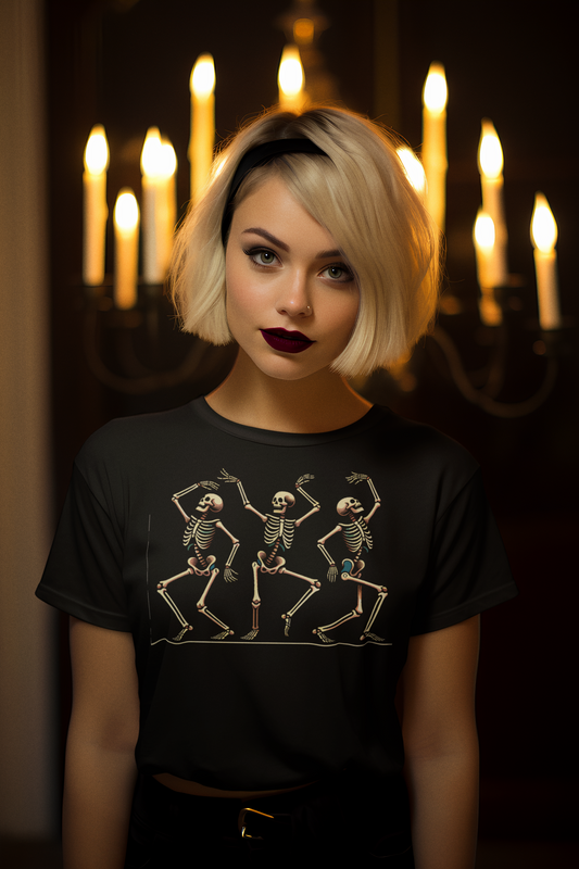 Woman with dark lipstick and a floral bomber jacket smiles brightly while wearing the Dancing Skeleton T-Shirt in black, featuring playful bone figures mid-dance for Halloween.