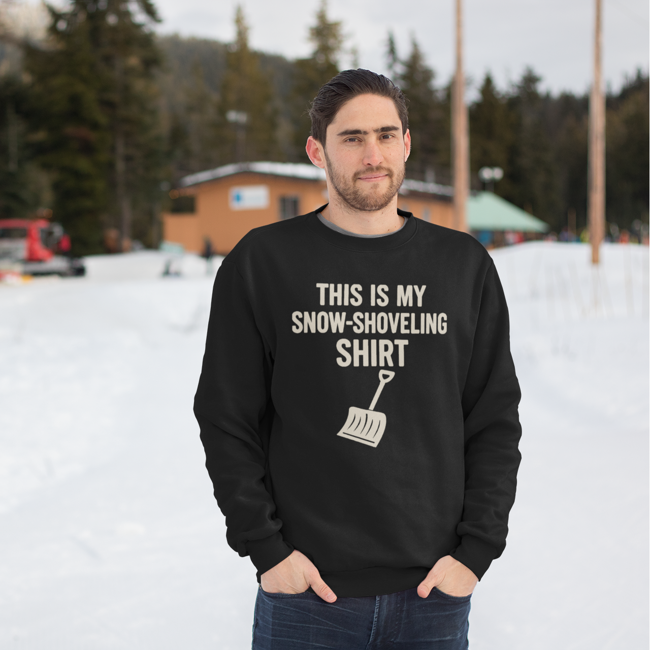 This Is My Snow-Shoveling Shirt – Funny Winter Chore Sweatshirt modeled in a snowy environment, highlighting bold winter humor and cozy cold-weather apparel
