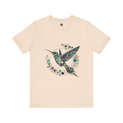 Hummingbird Dot Art T-Shirt – Colorful Nature-Inspired Graphic Tee in creamy beige shade with bold bird silhouette and colorful dot art, perfect for fans of hummingbird dot art.