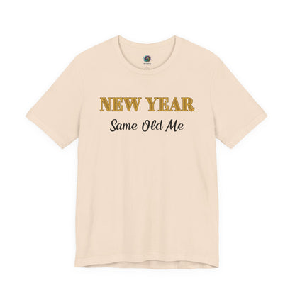 New Year Same Old Me T-Shirt – Funny Self-Confidence Tee in Soft Cream, showing the warm neutral fabric paired with celebratory typography.