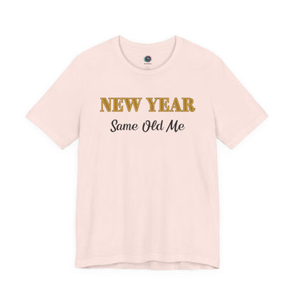 New Year Same Old Me T-Shirt – Funny Self-Confidence Tee in Soft Pink, featuring a playful New Year message with a light, festive feel.