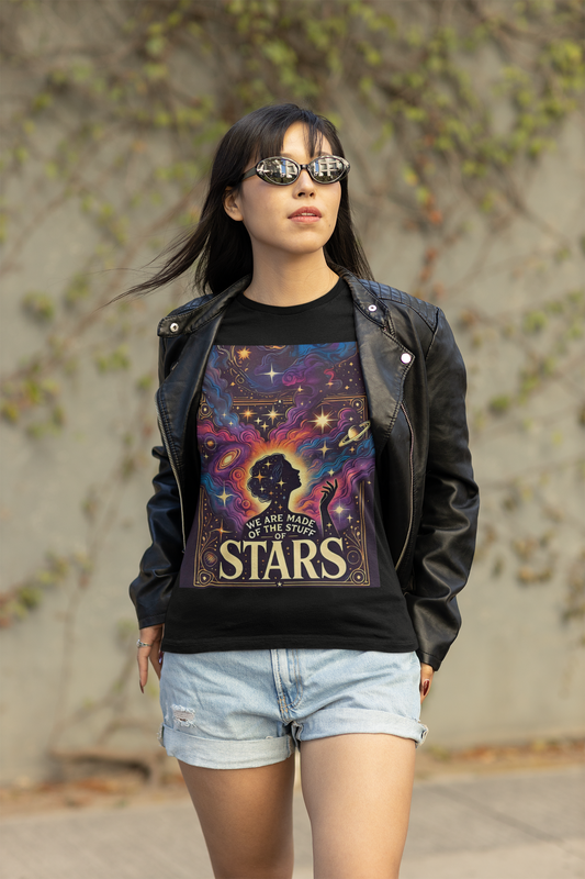 Woman wearing a cosmic art t‑shirt with a celestial silhouette and colorful nebula print, styled as cosmic clothing for mindful, starry vibes.