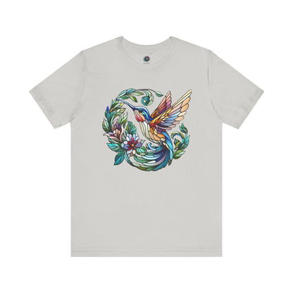 Stained Glass Hummingbird T-Shirt – Colorful Floral Bird Graphic Tee in silver featuring a vibrant stained glass hummingbird motif with floral elements.
