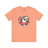 Shark Flamingo Floatie T-Shirt – Funny Beach & Pool Day Tee in sunset orange with quirky beach shark and floatie print