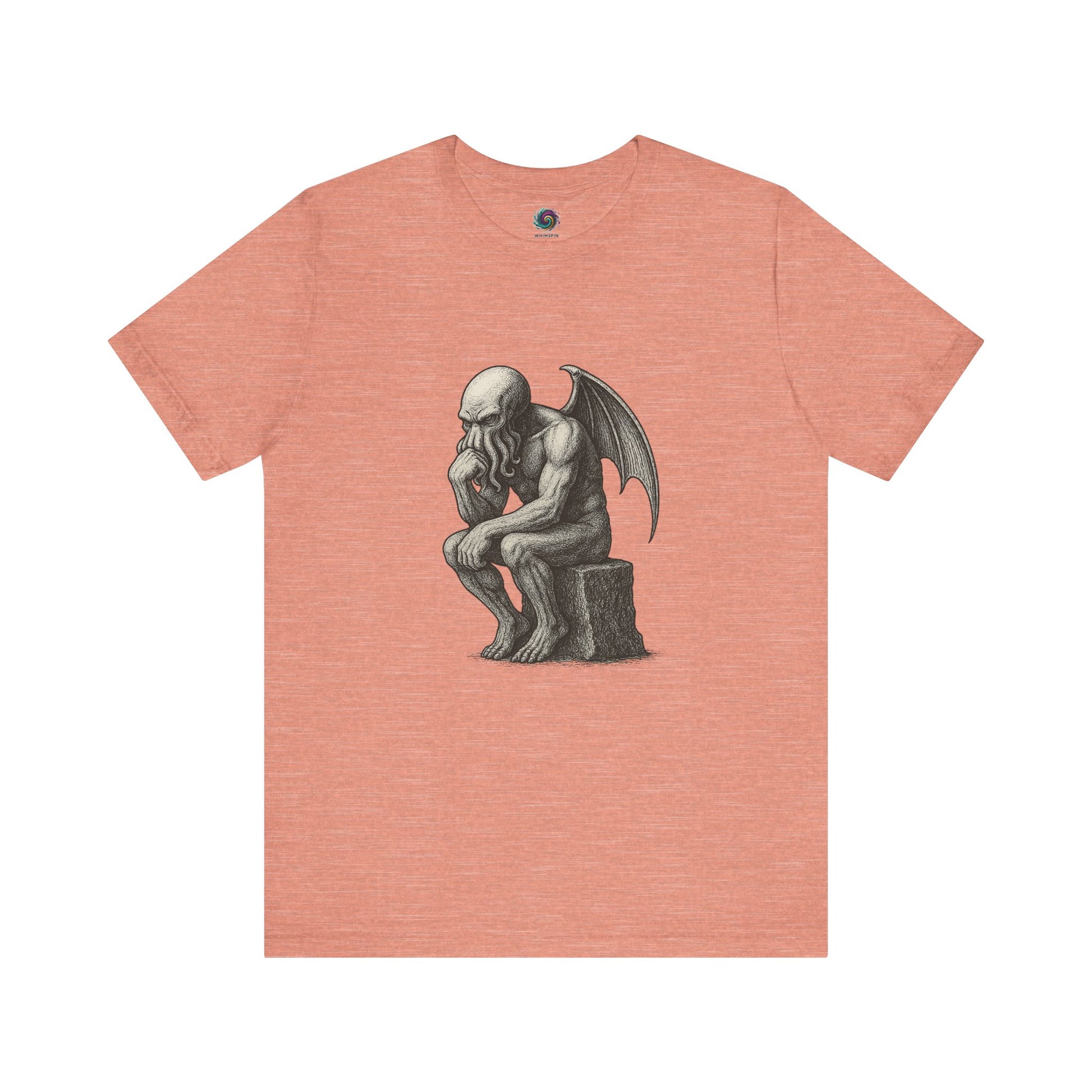 Peach-colored t-shirt with a black and white illustration of Cthulhu posed as Rodin's The Thinker.  The tee shirt is displayed on a hite background. 