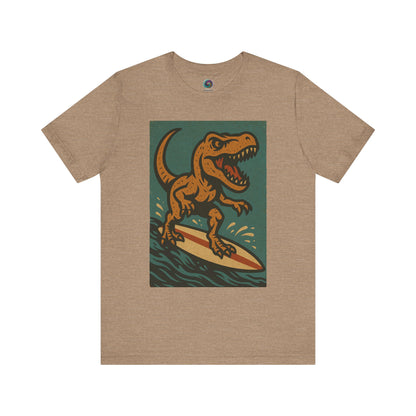 Tan Surfing t-rex t shirt  from WhimSpin- A rearing t Rex riding a yellow surf board on the waves