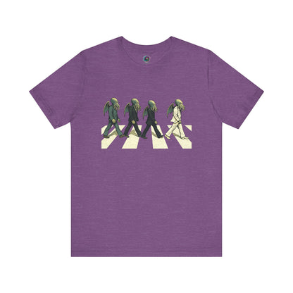 Cthulhu Crossing T-Shirt – Beatles Abbey Road Parody Tee in heather team purple, flat lay featuring funny Cthulhu parody design.