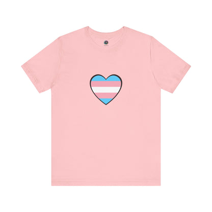 Transgender Pride Flag Heart T-Shirt – LGBTQ+ Trans Flag Graphic Tee in soft pink, showing a stylized trans heart inspired by the trans heart emoji and flag symbolism.