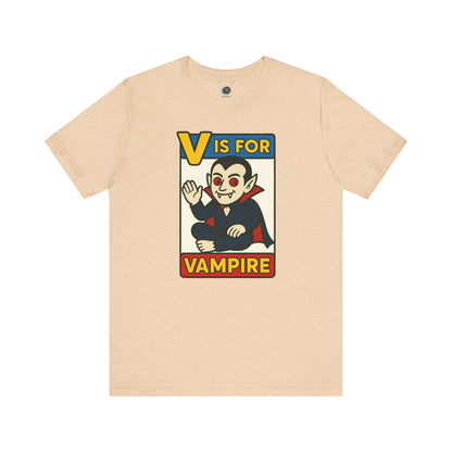 V is for Vampire T-Shirt – Funny Halloween Legend Alphabet Tee shown in flat lay style in the Heather Sand Dune color
