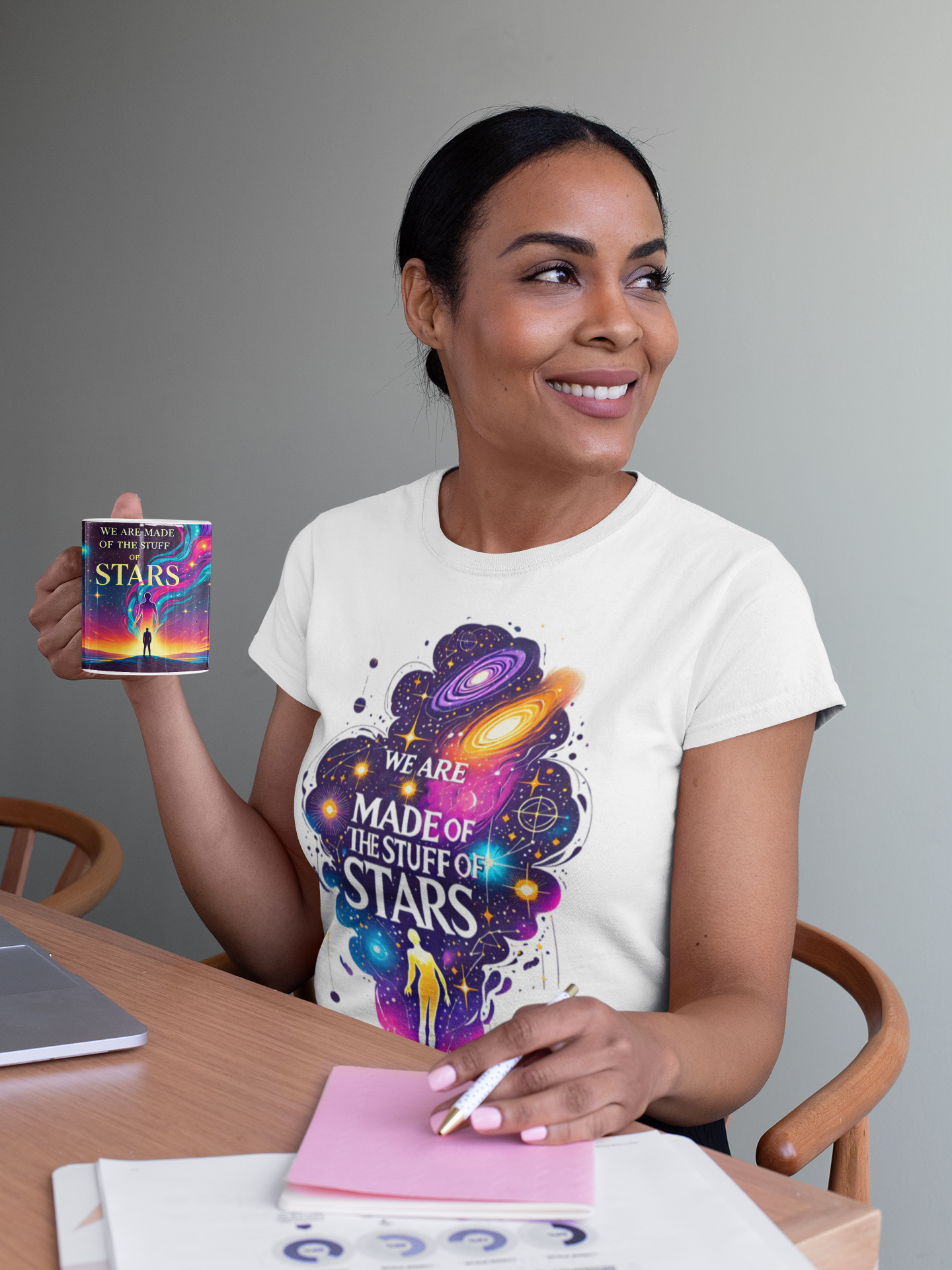 We Are Made of Star Stuff T-Shirt – Cosmic Galaxy Tee Shirt in white worn by a woman holding the matching mug, ideal Carl Sagan shirt for stargazers, thinkers, and dreamers.