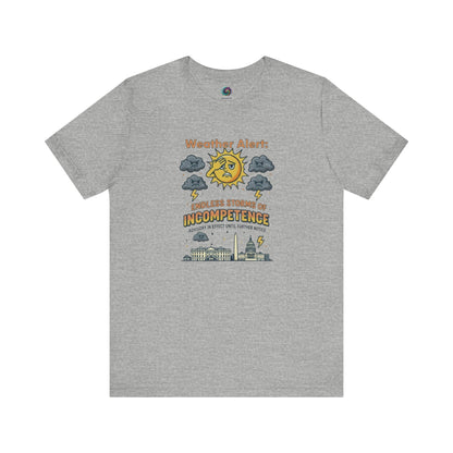 Weather Alert: Endless Storms of Incompetence Political Satire T-Shirt in athletic heather. Graphic features a distressed cartoon sun, storm clouds, and U.S. Capitol buildings.