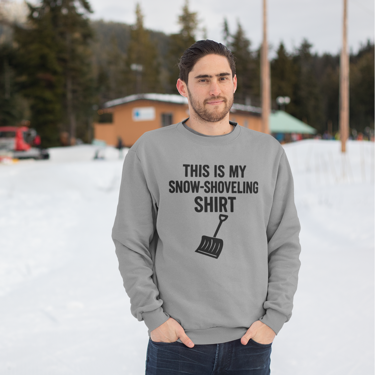 This Is My Snow-Shoveling Shirt – Funny Winter Chore Sweatshirt worn in a snowy outdoor scene, featuring the snow shovel graphic and winter-ready style
