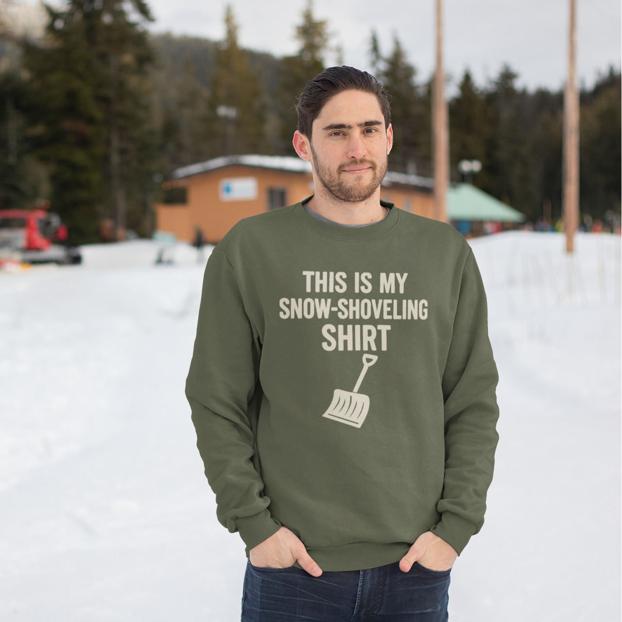 This Is My Snow-Shoveling Shirt – Funny Winter Chore Sweatshirt worn in a snowy outdoor landscape, emphasizing winter storm humor and cold weather comfort
