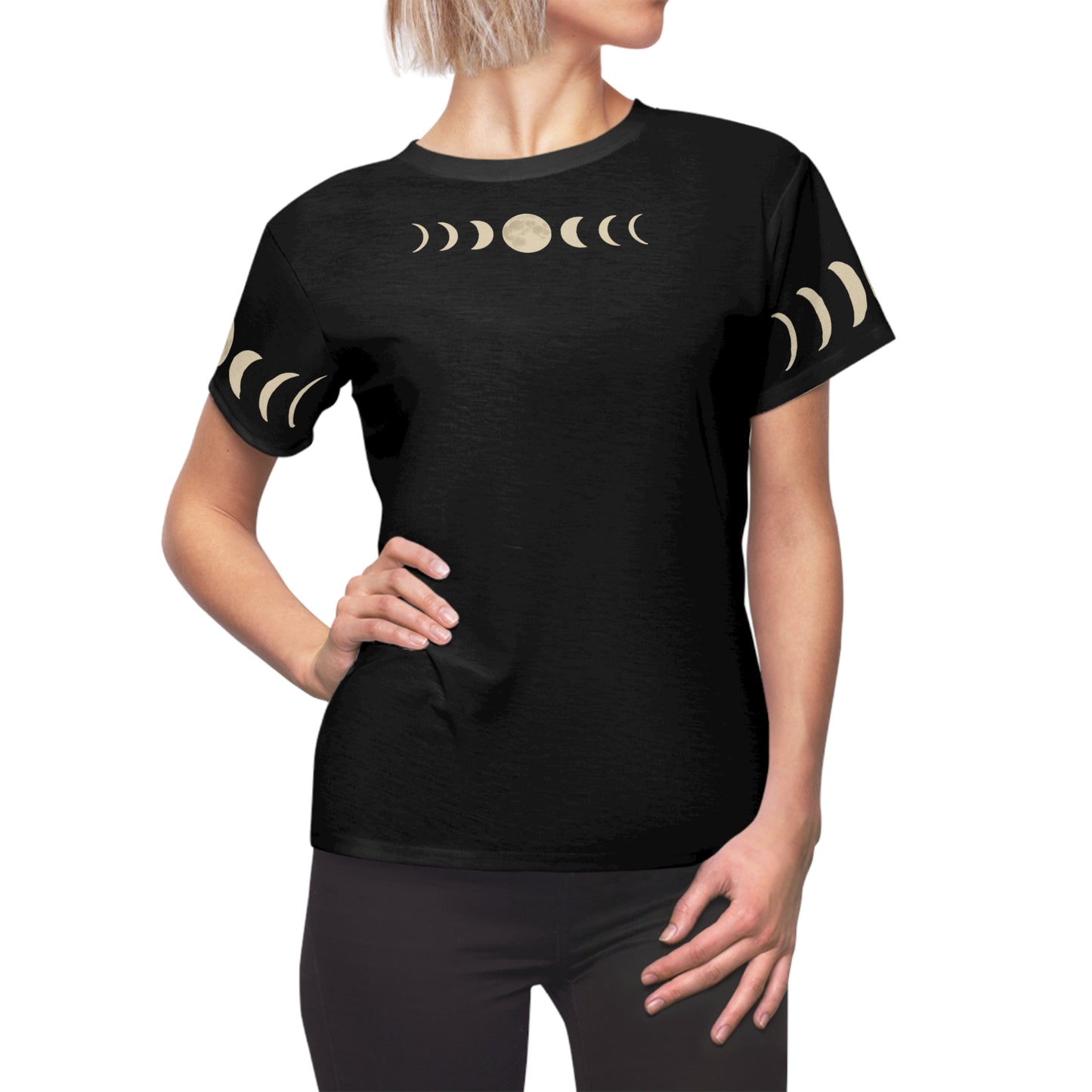 Woman modeling the Moon Phases T-Shirt – Pagan Moons Shirt for Mystical Night Style in black all-over print, front view shows moon phases across chest and sleeves, standing with hand on hip