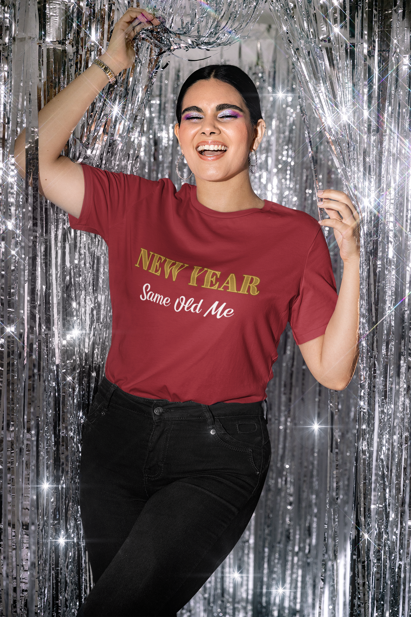 Image of a woman wearing the New Year Same Old Me T-Shirt – Funny Self-Confidence Tee in red, smiling and holding silver streamers in a lively New Year party scene.