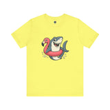 Shark Flamingo Floatie T-Shirt – Funny Beach & Pool Day Tee Yellow shirt for sunny beach and pool fun with a funny image of a shark in a floatie shaped like a flamingo