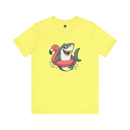 Shark Flamingo Floatie T-Shirt – Funny Beach & Pool Day Tee Yellow shirt for sunny beach and pool fun with a funny image of a shark in a floatie shaped like a flamingo
