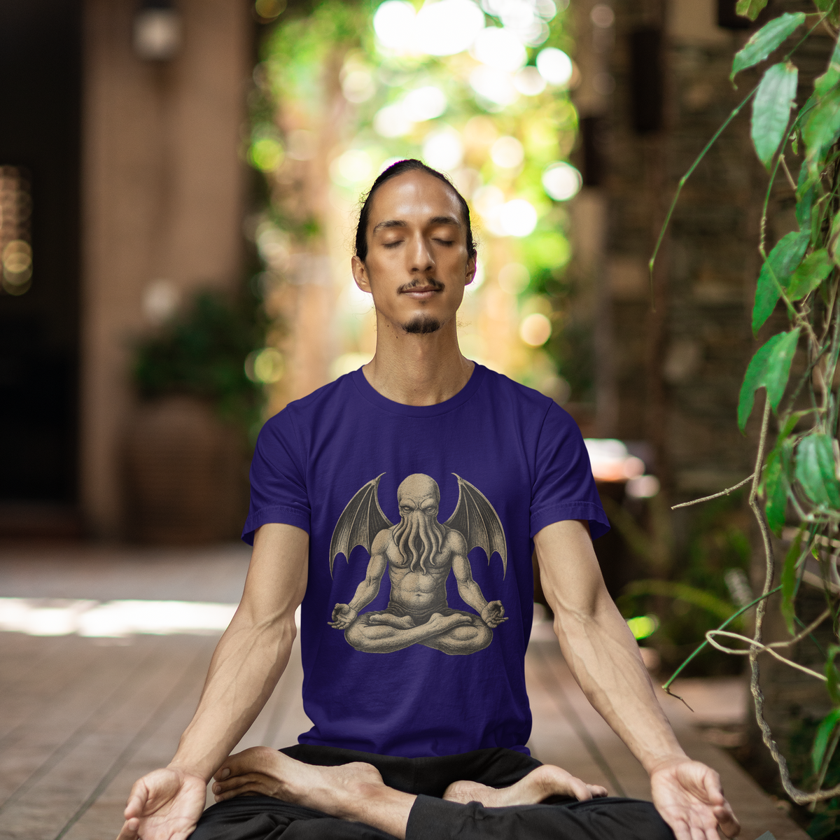 Meditating Cthulhu Shirt – Unisex Mythos Tee for Sci-Fi & Festival Fans in purple featuring a cosmic Lovecraftian elder god in a peaceful lotus pose, perfect for fans of Cthulhu meditation and dark mythology.