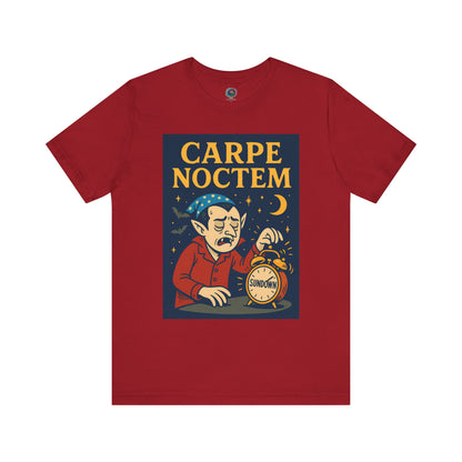cardinal red tshirt with 'Carpe Noctem' graphic design featuring a vampire with an alarm clock and moon, struggling to wake up for the night. Perfect for Halloween parties, lovers of the nigh, night owls, and people who are not afraid of what goes bump in the night.