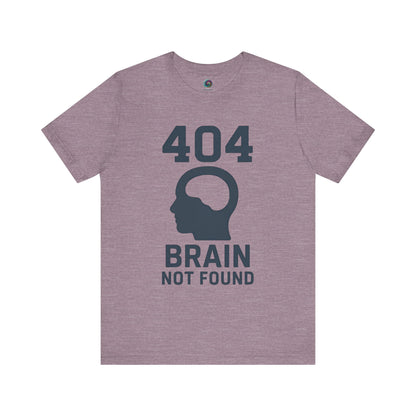 heather purple "404 Brain Not Found T-Shirt" from WhimSpin. The tshirt graphic is a profile image of a human head with an empty hole where the brain should be and the text "404 Brain Not Found."