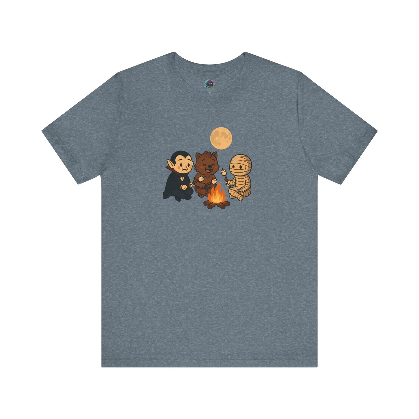 Flat lay of the Heather Slate Halloween Monsters Campfire T-Shirt showing friendly Halloween characters gathered around a cozy campfire with marshmallows.
