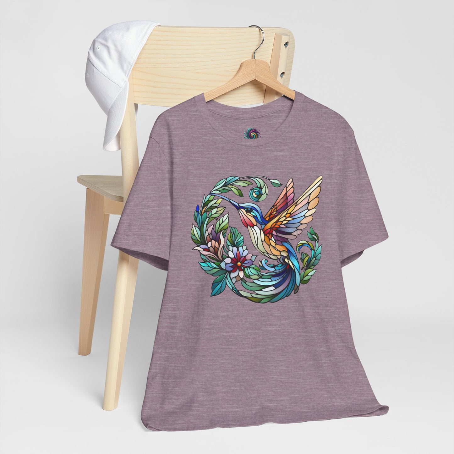 Stained Glass Hummingbird T-Shirt – Colorful Floral Bird Graphic Tee in heather purple with colorful stained glass-style hummingbird and floral detailing.