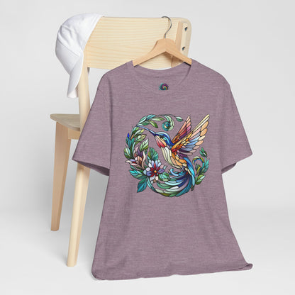 Stained Glass Hummingbird T-Shirt – Colorful Floral Bird Graphic Tee in heather purple with colorful stained glass-style hummingbird and floral detailing.