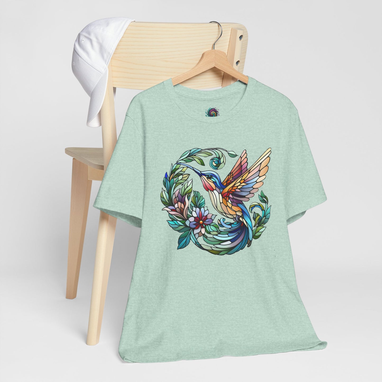 Stained Glass Hummingbird T-Shirt – Colorful Floral Bird Graphic Tee in heather prism mint featuring a stained glass hummingbird and ring of leaves and flowers