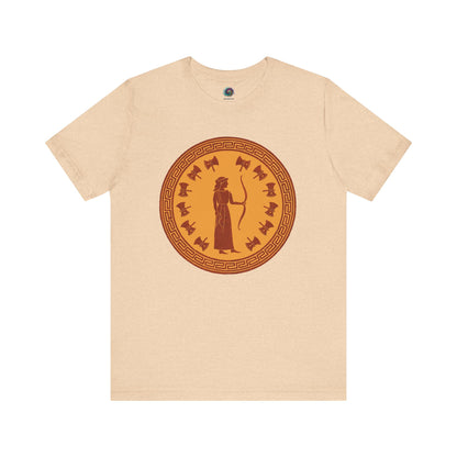 Sand yellow Penelope Epic Queen of Ithaca T shirt from Whimspin. The shirt features an image of a woman in ancient Grecian robes holding a bow and surrounded by 12 axes. The images is in terracotta cotta red and gold in the style of ancient amphora art. 